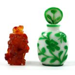 (lot of 2) Chinese snuff bottles: one of carnelian carved of Liu Hai, reversed by squirrels and
