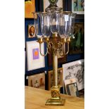 Classical style gilt bronze candelabra, having five lights with clear glass shades and gilt rims,