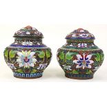 Pair of Chinese champleve lidded jars, each with stylized lotus scrolls, together with a dome lid,