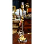 Hollywood Regency single light lamp, having crystal tear drop prisms above the brushed metal base,