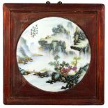 Chinese enameled circular porcelain plaque, of a scenic landscape with a figure crossing a bridge,