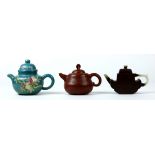 (lot of 3) Chinese zisha ceramic teapots: first with a rounded low slung body incised with a