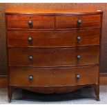 George III mahogany bow front chest, having a shaped crest, above the five drawer case, and rising