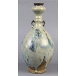 Chinese Jun-type glazed ceramic bottle, with a splayed mouth and garlic head above a ribbed neck