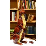 Ceramic polychrome decorated rabbit sculpture, depicted standing on hind legs with ears raised, 25.