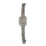 Lady's Omega diamond and white gold convertible-covered wristwatch Dial: square, off white,