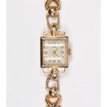 Lady's 14k yellow gold wristwatch Dial; square, raised diamond pattern, (discolored), applied Arabic