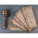 (lot of 2) Himalayan copper and wood prayer wheel; together with a sutra feather a leather cover,