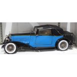 Rolls Royce Model, having a canvas covered roof and bright blue finish, 26"l