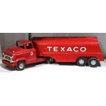 Vintage "Tour With Texaco" model tanker truck, 1950's, having a red finish, 24"l