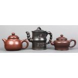 (lot of 3) Chinese zisha ceramic teapots, each marked 'Shi Chunming': first, with a high angular