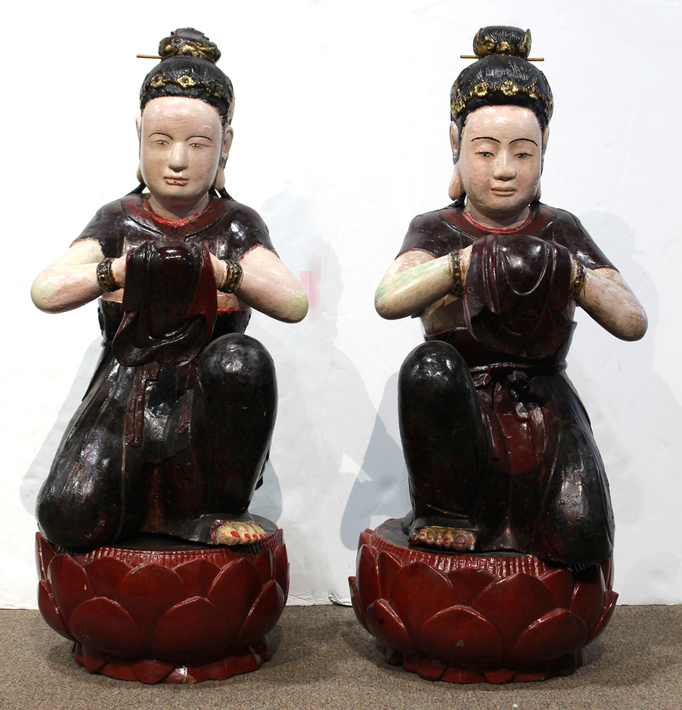 Pair of Vietnamese polychrome lacquered wooden apsaras, in a genuflection position with cloth draped