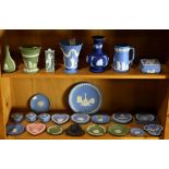 Two shelves of mostly Wedgwood jasperware including dishes and vases in blue and green, largest: 6"