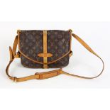 Louis Vuitton Saumur shoulder bag, with brown monogram coated canvas, tan leather accents and golden