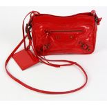 Balenciaga shoulder bag, in flashy red dotted patent leather, bronze color hardware, and strap