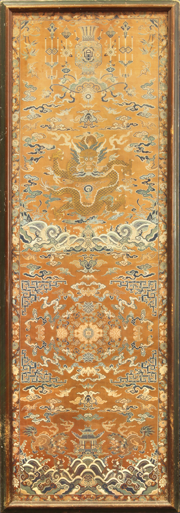 Chinese orange ground brocade silk chair cover, featuring a meandering gilt dragon, above a floral