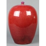 Chinese flambe glazed porcelain lidded jar, with a tapering ovoid body, topped with a possibly
