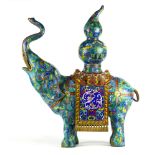 Chinese cloisonne enameled elephant, with a double gourd vessel set on the carparisoned blue