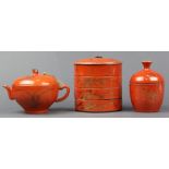 (lot of 3) Chinese gilt orange porcelain, consisting of a lidded container with flowers; a teapot