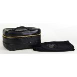 Chanel rectangular cosmetic case, executed in black calf leather with a quilted base, gilt