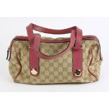 Gucci Charmy Boston handbag, having monogrammed beige canvas, 152457-492783, 29 x 17 x10 cm