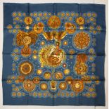 Hermes silk "Le Roy Soliel" scarf, executed in blue, yellow, and brown, 90cm square