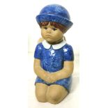 Lisa Larson for Gustavsberg figural sculpture, depicting a kneeling child wearing a blue cap, 7"h