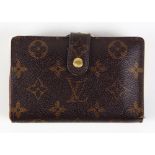 Louis Vuitton wallet, having a canvas monogram exterior with brass hardware 3.5"h x 5"w