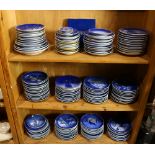 Three shelves of Danish commemorative plates, including Bing and Grondhal and Royal Copenhagen,