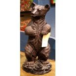 Patinated bronze bear sculpture, depicted standing on a rocky base signed Florin, 23.5"h X 9"w