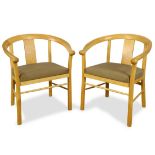 Pair of Berkeley Mills Horseshoe armchairs, each having a contoured back, and rising on