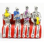 Josefina Aguilar Day of the Dead sculpture, depicting skeletons seated on a bench playing stylized
