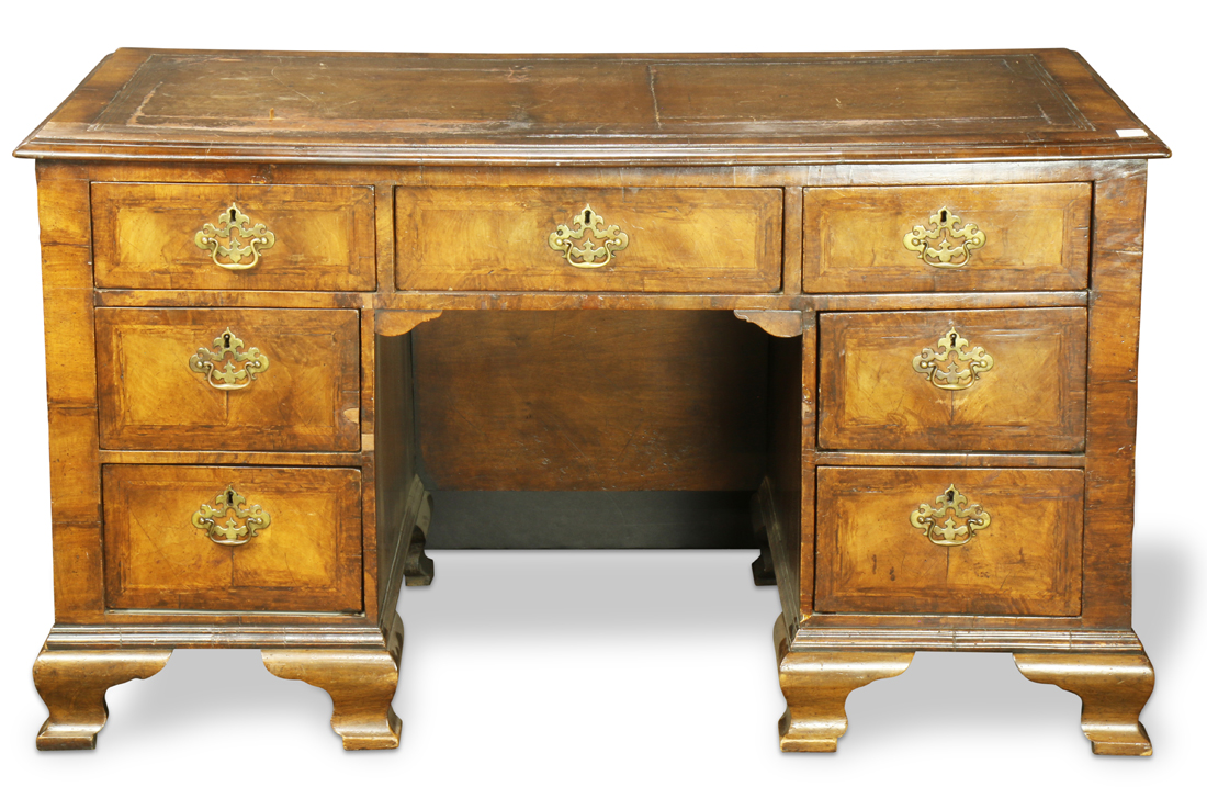 George III desk circa 1770, executed in walnut, having reticulated brass pulls, the fronts with