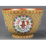 Chinese enameled porcelain bowl, the exterior with wanzi pattern on a yellow ground with reserves