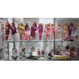 Two shelves of dolls, mostly Barbies, most dating to the 1970s, also including Skipper in original