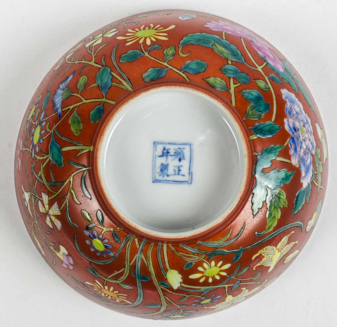 Chinese enameled porcelain bowl, featuring various flowers on an orange ground, base with apocryphal - Image 3 of 3