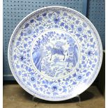 Chinese underglazed blue porcelain charger, the center featuring a roundel with a qilin in