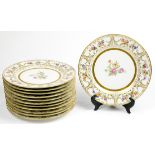 (lot of 12) Limoges service plates, each having a gilt rim, centered with floral decoration, 10.5"