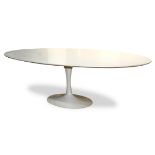 Eero Saarinen for Knoll International Tulip dining table, having an oval white laminate top, above