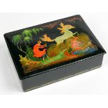 Russian Palekh lacquer box, the lid having a polychrome decorated scene depicting a horse and rider,