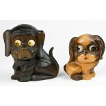 (lot of 2) German eye dial clocks, each having a carved wood figural case in the form of a dog,