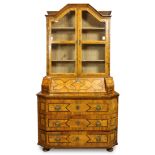 Biedermeier inlaid secretary circa 1820, having a molded crest, above two paneled doors opening to a