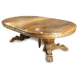 Classical style mahogany dining table, having a circular top with two 17.5"l leaves, and rising on