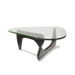 Isamu Noguchi style IN50 coffee table, having a plate glass top, above a curved ebonized wood