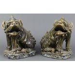 Vietnamese Battrang style ceramic fu-lions (nghe), each with blue and celadon fur, seated on its