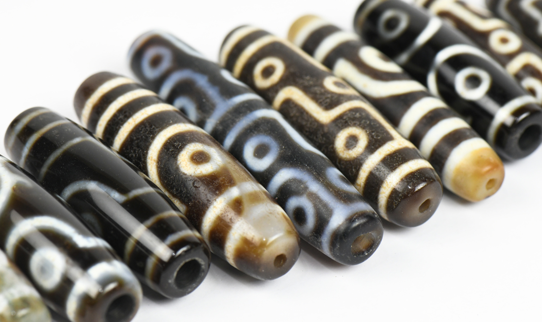 (lot of 10) Tianzhu/Dzi-style beads, mostly of cylindrical form with 'eyes', largest; 2.75"w - Image 3 of 3