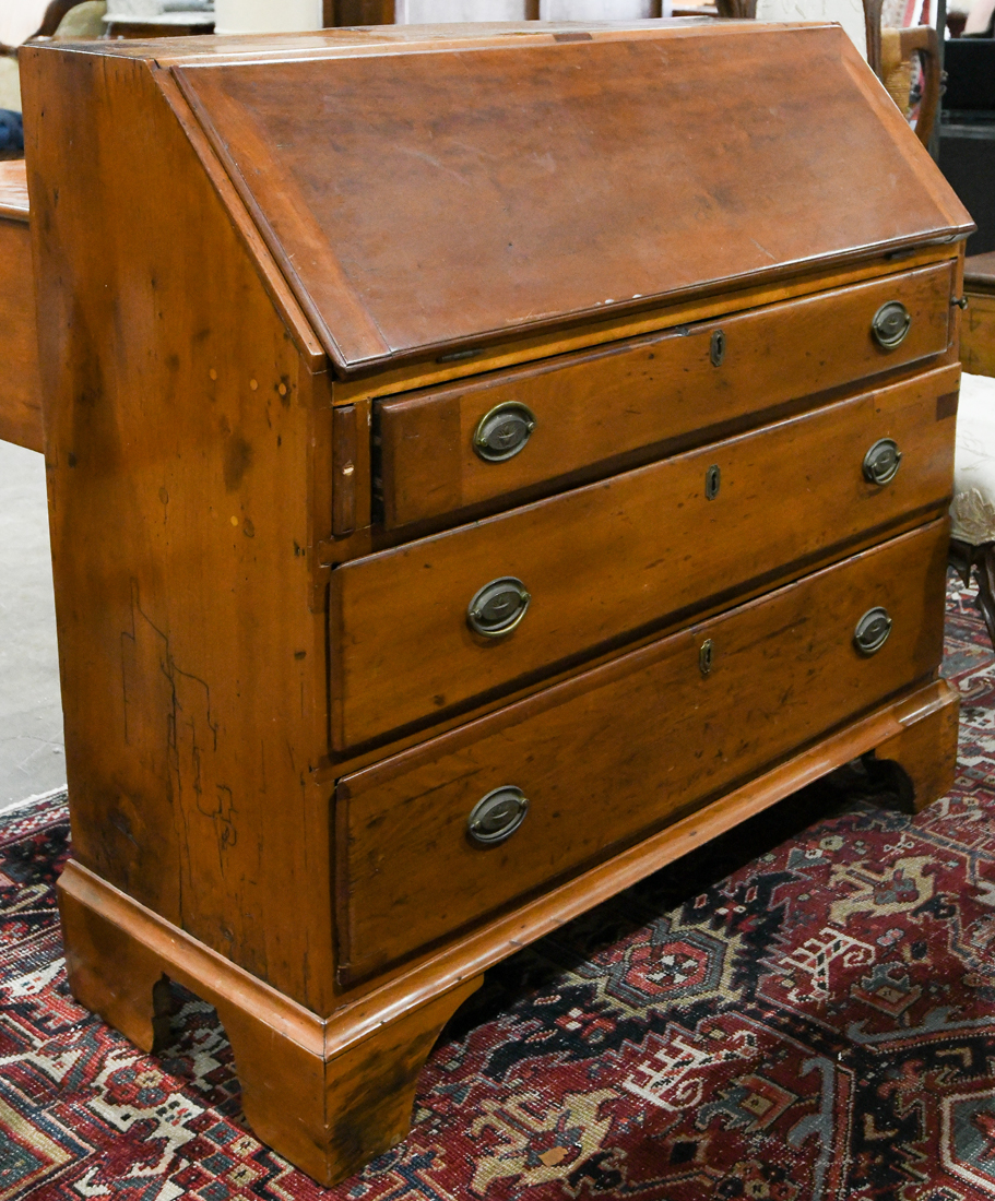 George III slant front desk, the three drawer case rising on bracket feet, 39"h x 41"w x 17"d
