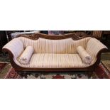 Renaissance style carved walnut sofa circa 1890 with striped upholstery and two bolsters