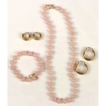 (Lot of 4) Rose quartz and 14k yellow gold jewelry Including 1) pair of 14k yellow gold hoop