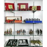 Four shelves of toy soldiers, including Traditional Models for the Collector by Trophy Miniatures,